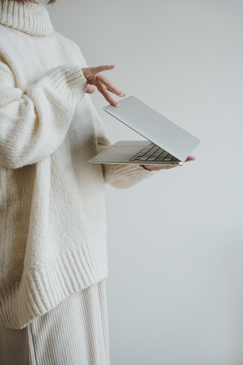 Person Closing Laptop